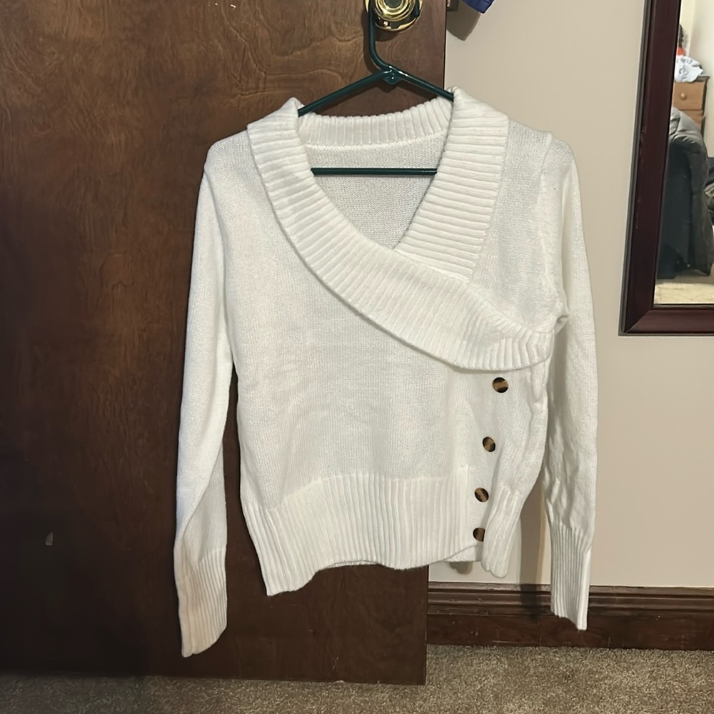 New white sweater.